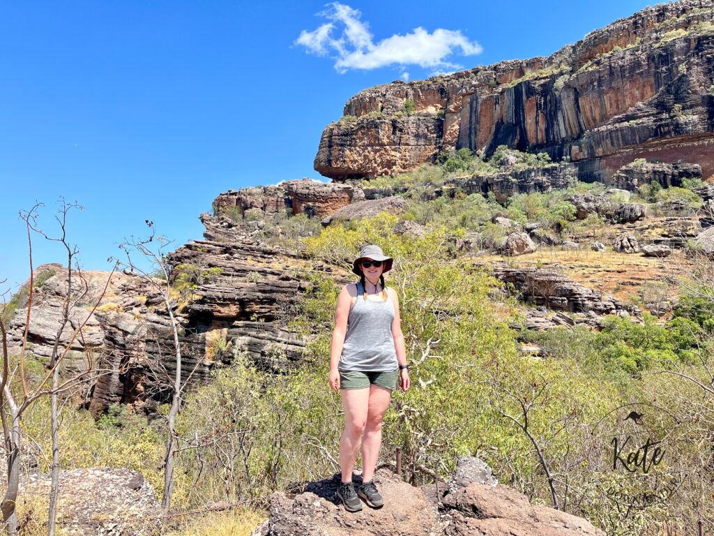 Kate standing in front of rock formations at Nourlangie