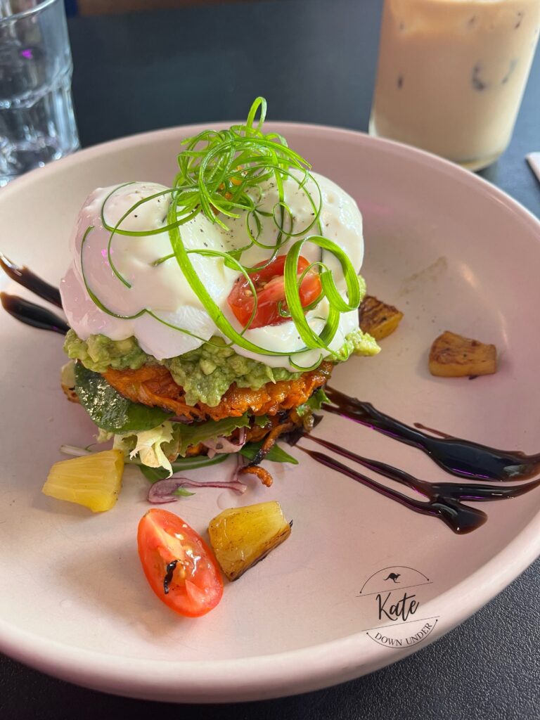Kate's 6 month commemorative brekky: a sweet potato and corn fritter with poached eggs, avo, cherry tomatoes, a grilled pineapple salad and horseradish yogurt sauce