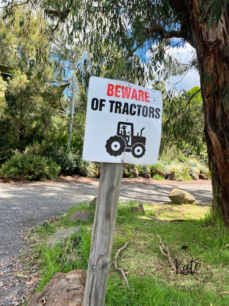 A sign that reads "beware of tractors"