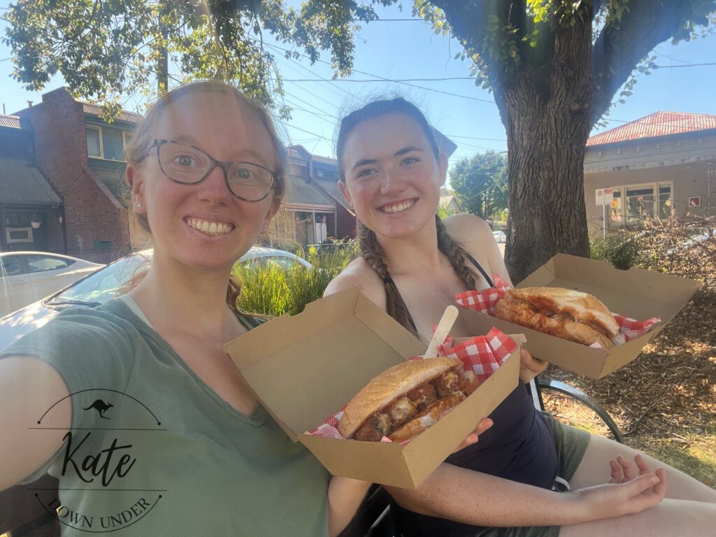 Sydney and Kate showing off their meatball subs from Nonna's House